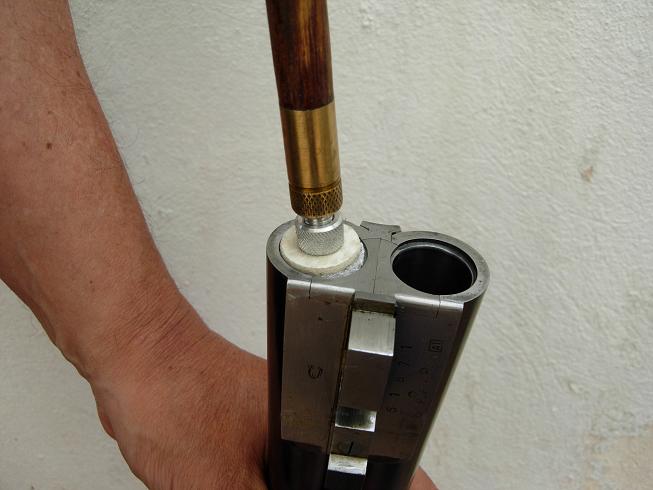 Pass the rod from chamber to muzzle dry, with no oil, to remove visible fouling.