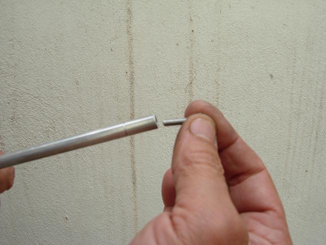 Thread the 8-32 headless bolt onto the rod thread.